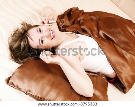 Young woman relaxing in the bedroom