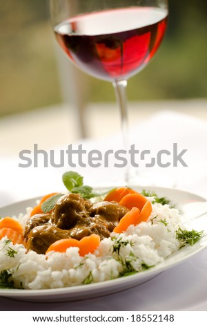 Rice and meatballs, red wine - delicious dinner