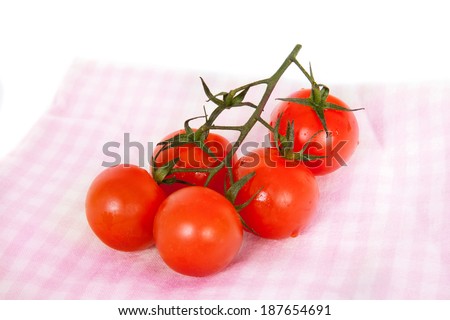 the branch of the cherry tomatoes on a napkin