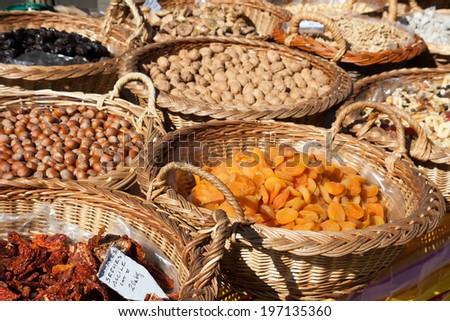 The dry fruits in basket on street market of a small town