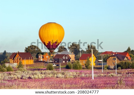 the landing of the balloon among country houses