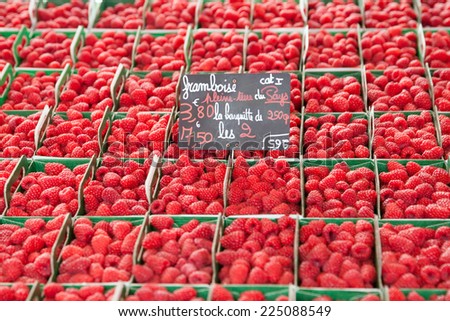 ripe raspberries on the market