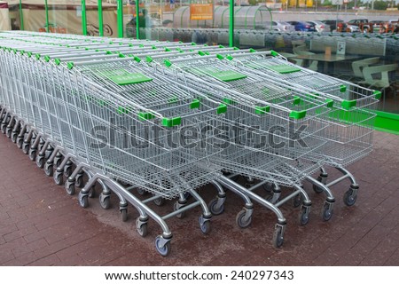 KRASNOGORSK, RUSSIA - MAY 17, 2014: The row of empty shopping carts before entry into supermarket