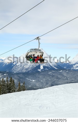 SEEFELD, AUSTRIA - JAN 05, 2015: The five skiers are ascending by chair lift on mountain ski resort