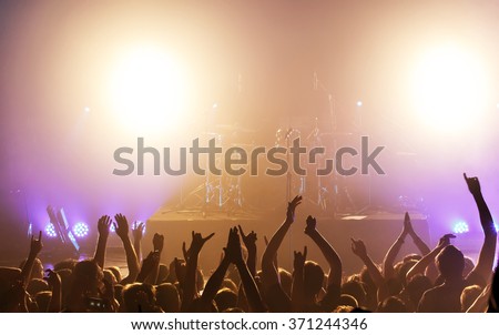 Black silhouette of people on rock concert