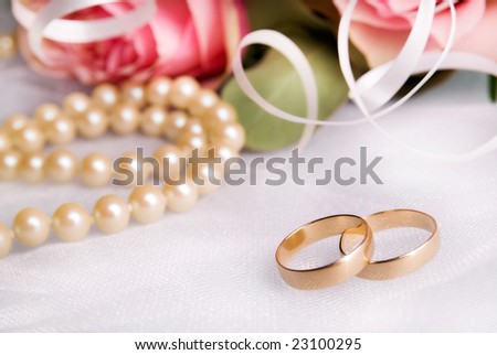 stock photo wedding rings with flowers and pearls