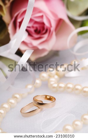 stock photo wedding rings with flowers and pearls