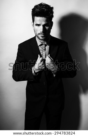 handsome young man in suit on grey background. Business man