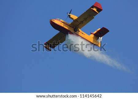 Fire-fighting aircraft drops water