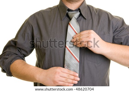 putting on tie