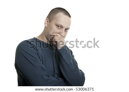 stock photo : suspicious young caucasian man with short hair and beard thinking