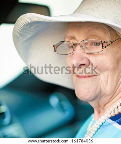 senior woman in a car close up portrait