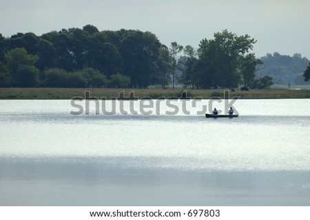 canoe with fishermen