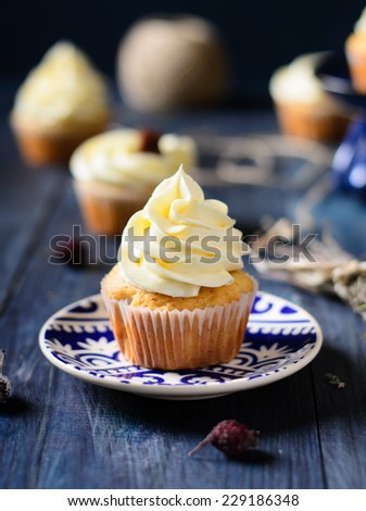 Banana cupcakes on a wooden table