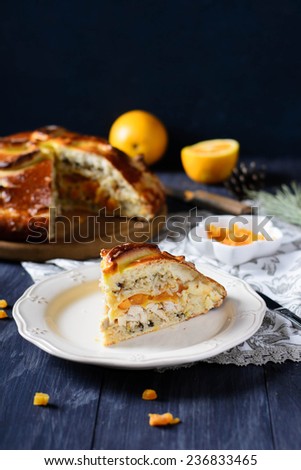 Traditional russian pie Kurnik with chicken, rice and dried apricot