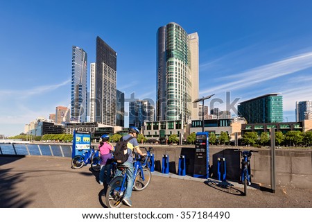 Melbourne, Victoria, Australia - Circa October 2015: Tourists rent bicycles from the bike share system, initiated by the Victoria Government.