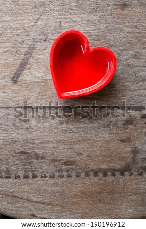 Heart symbol and wood background.