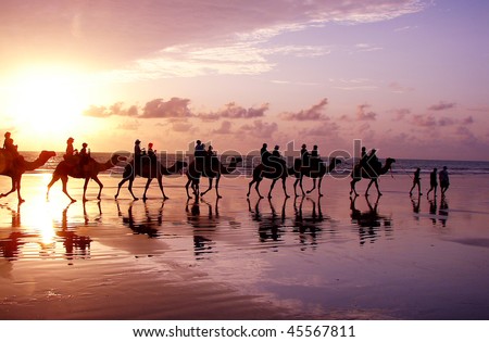 Ocean Sunrise with people and camels