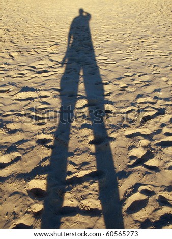 human shadow in desert