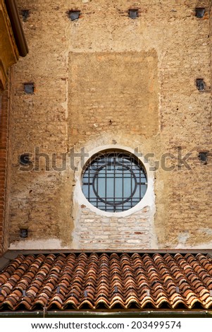 lonate pozzolo cross church varese italy the old rose window   and mosaic wall in the sky