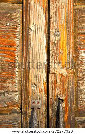 abstract  house door    in italy   lombardy   column  the milano old        closed nail rusty