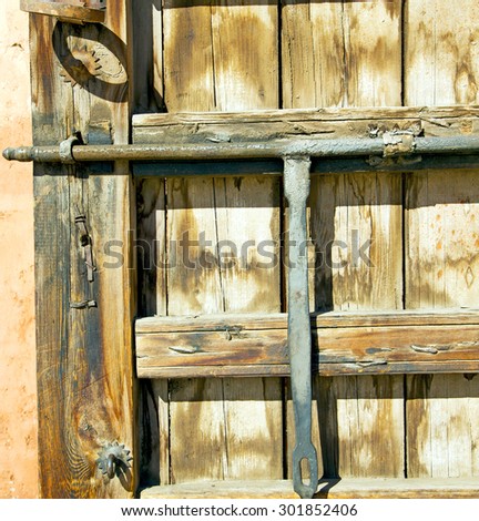 brown    morocco in    africa the old wood  facade home and rusty safe padlock