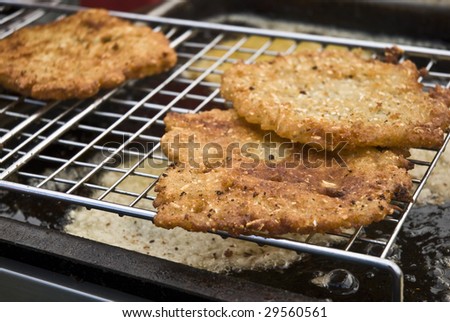 potato pancake - frying in oil.