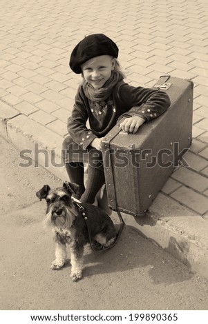Vintage photo of a little girl and his dog