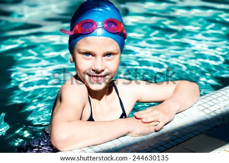 young swimmer training in the swimming pool