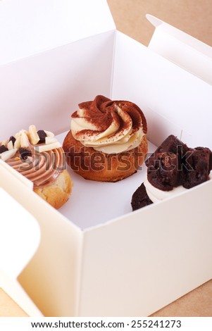 three cupcakes organize in a box