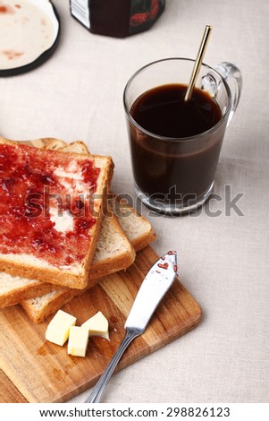 breakfast black coffee with whole wheat bread and jam