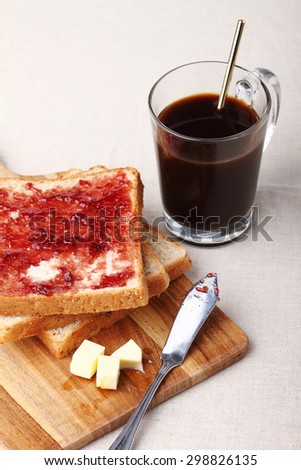 breakfast black coffee with whole wheat bread and jam