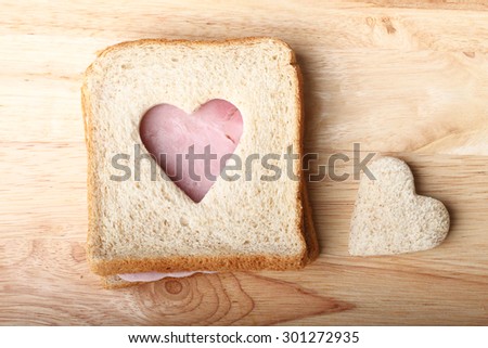 healthy whole wheat and ham sandwich, cut to heart shape