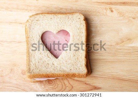 healthy whole wheat and ham sandwich, cut to heart shape