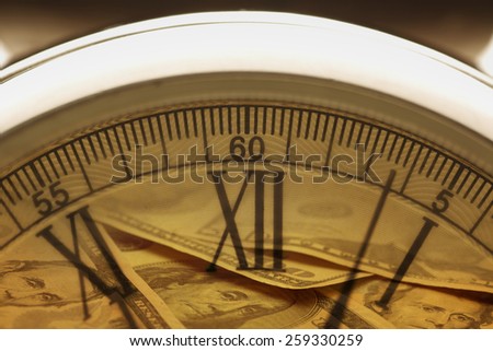 Time is money.  Clock in US dollars Clock, shot with very shallow depth of field