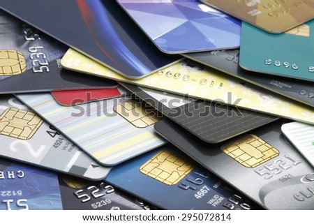 Colorful stack of credit cards and shopping gift cards. Macro with extremely shallow dof.