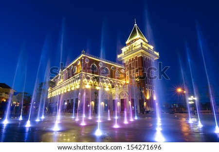 coloured jets water of fountain and the Main Guard building by night in the Venezia HuaHin Thailand