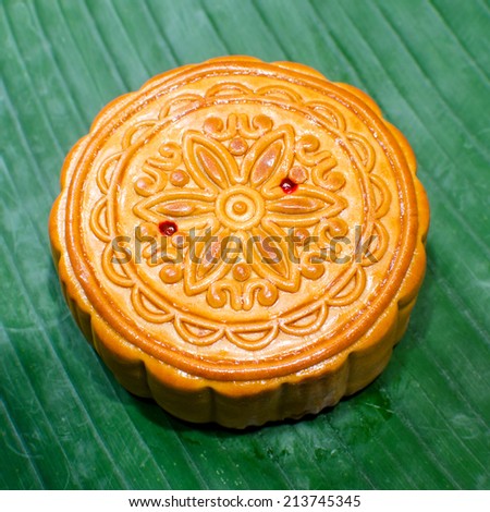 Traditional Mooncake on a Banana Leaf, no logo or trademark.