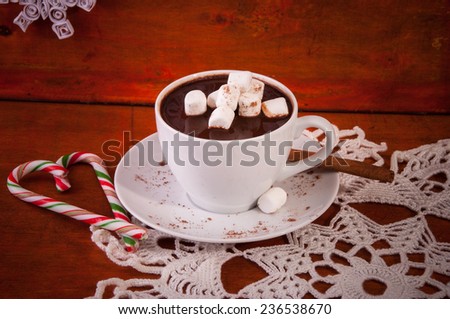 Hot Cholate in White Cup with Cinnamon Stick, Marshmallow and Candies