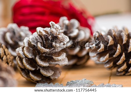 Homemade snow covered spruce cone