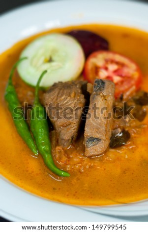 Spicy cooked fish curry. Cooked tuna fish. Fish with salads.