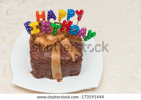 Birthday cake with chocolate and  candles isolated. Colored candles. birthday gift . Enjoy . Celebrate with cake and wine. with love. Many happy birthdays. Live long. light your birthday candles