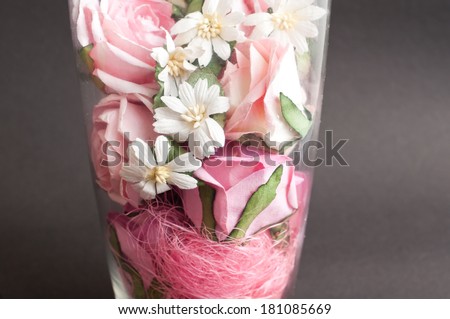 flower vase with beautiful red flowers. artificial paper rose flowers.