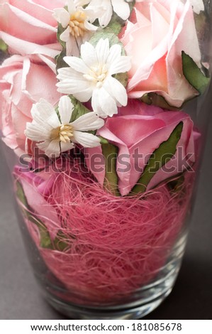 flower vase with beautiful red flowers. artificial paper rose flowers.