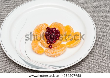 Orange mandarin or tangerine fruit. Orange Peeled and sliced.