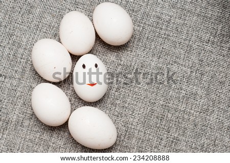 white eggs with smiling human face.