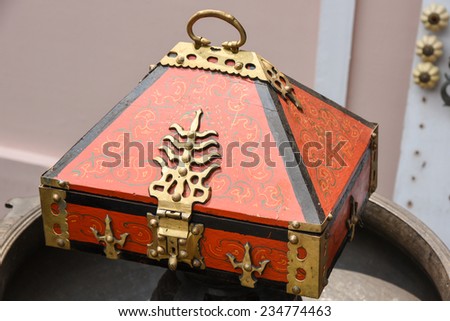 traditional treasure chest with jewelry in India. Vintage locker box made of wood and gold