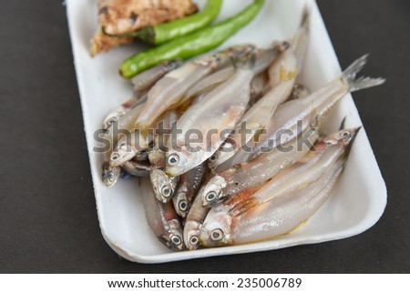 Raw Fish ready to cook with ginger onions and green chili. silver fish with calcium