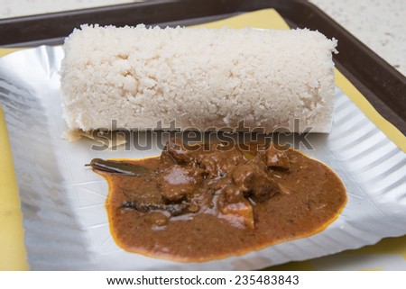 Steamed rice cake with beef curry Kerala India breakfast