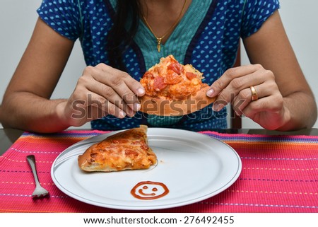 Pizza. Girl eating a delicious pizza.